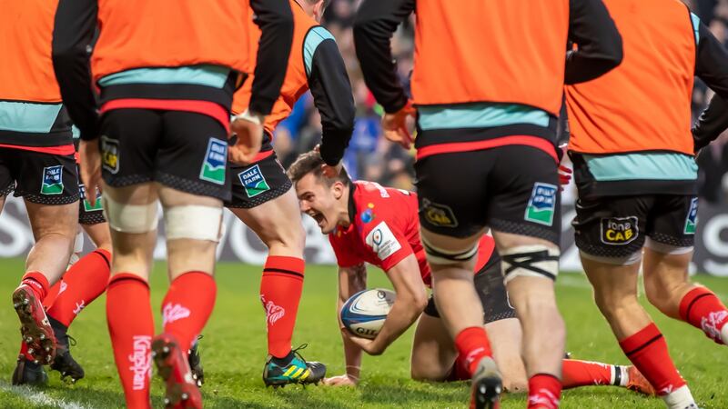 Ulster’s Jacob Stockdale celebrates scoring the match-winning try as his teammates rush in to congratulate him. Photograph: Morgan Treacy/Inpho