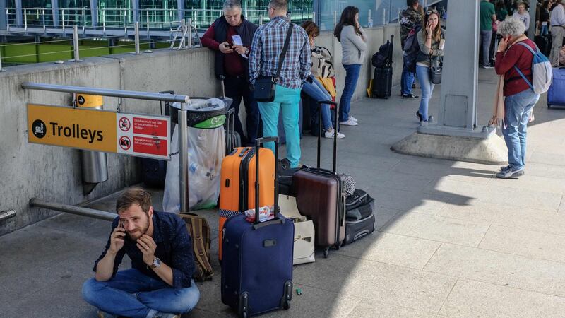 Travellers stranded outside the entrances of Heathrow Airport Terminal 5 after British Airways flights were cancelled. Photograph: AFP