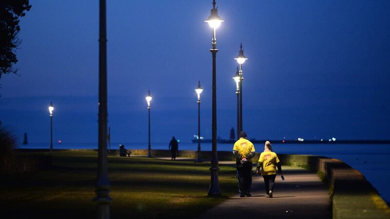 Walkers   in the Clontarf area of Dublin. Photograph: Dara Mac Dónaill