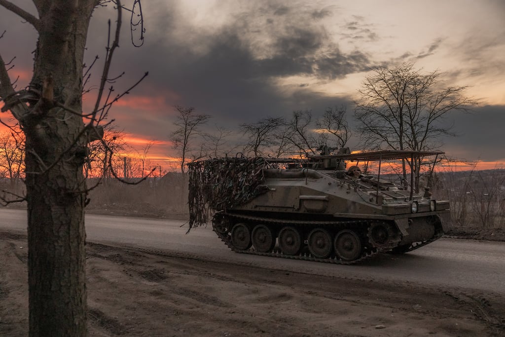 A Ukrainian serviceman drives a British FV103 Spartan armoured personnel carrier to the town of Chasiv Yar in the Donetsk region where Russia has focused its offensive. Photographer: Roman PILIPEY/AFP via Getty Images)