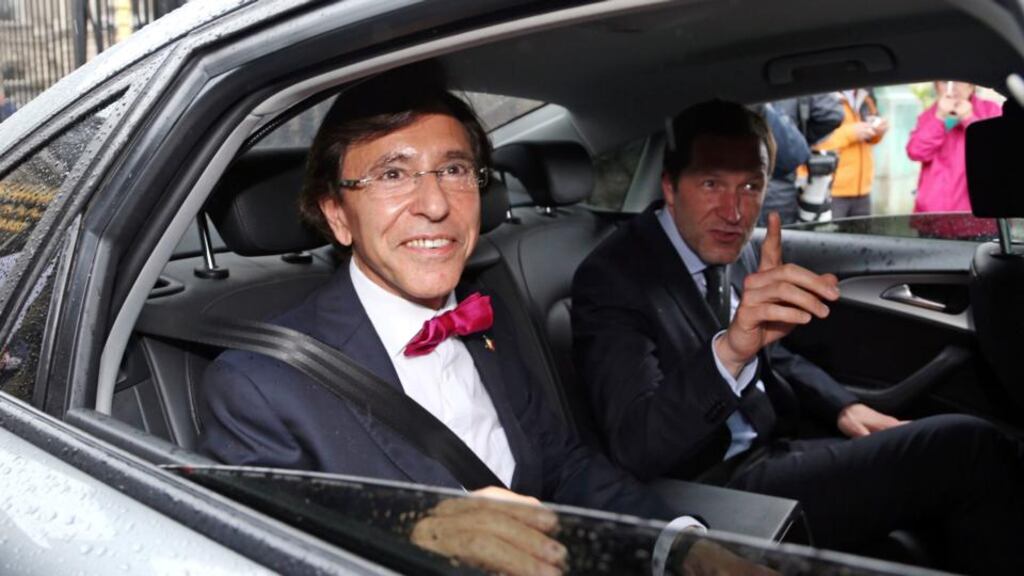 Belgium’s prime minister Elio Di Rupo (left) and Francophone Socialist party (PS) chairman Paul Magnette leave a meeting with King Philippe at the Royal Palace in Brussels. Photograph: Francois Lenoir/Reuters