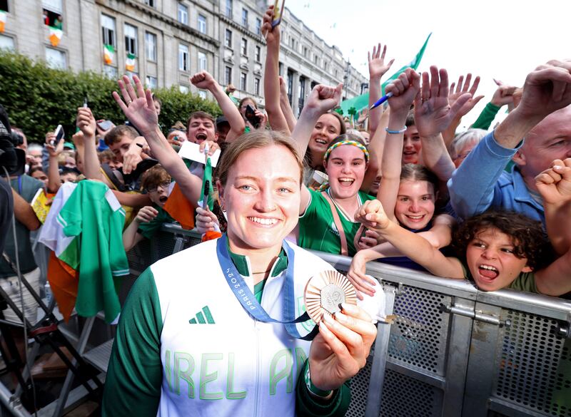 Bronze swimming medallist Mona McSharry surrounded by fans on O'Connell Street, Dublin, in August 2024, at a homecoming welcome for Irish Olympic athletes. Photograph: Colin Keegan/Collins Dublin