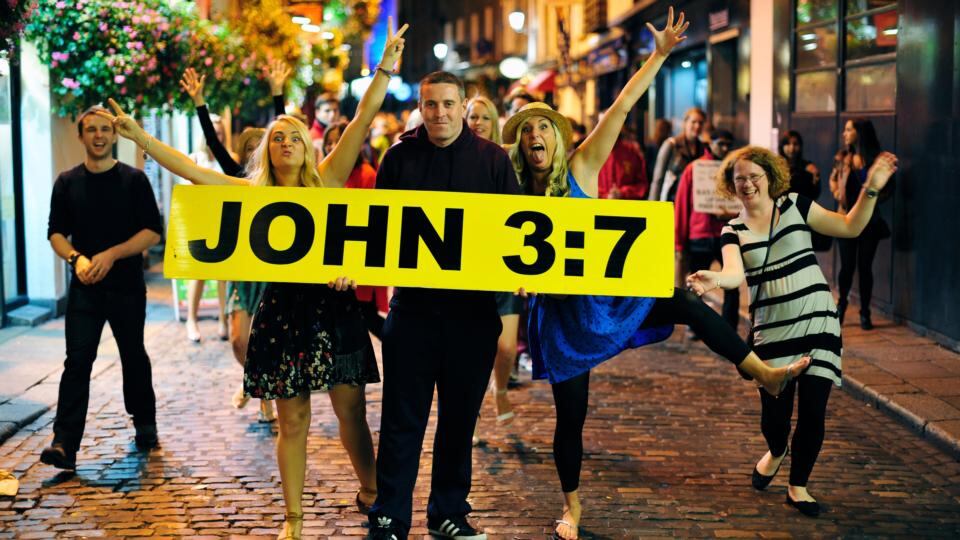 10.45pm: photobombers help to spread the word that the choice in the gospel is like Neo’s choice in 'The Matrix'. Photograph: Aidan Crawley