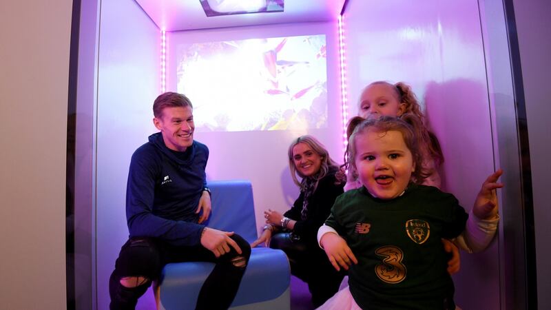Irish soccer star James McClean with his wife, Erin, and children Allie (6) and Willow (2) in the Aviva Stadium’s new Sensory Hub. Photograph: Ramsey Cardy/Sportsfile