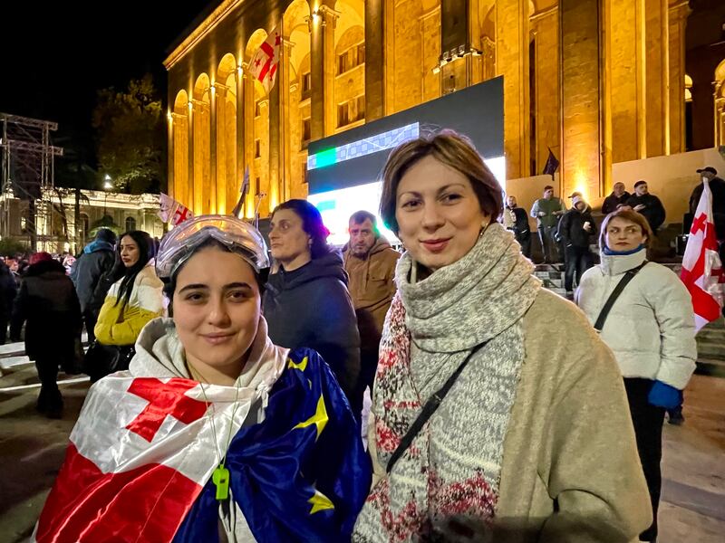 Elene Abdushelishvili and Nino Goginashvili, members of liberal Georgian opposition party Akhali, protest outside parliament in Tbilisi on Monday night. Photograph: Daniel McLaughlin