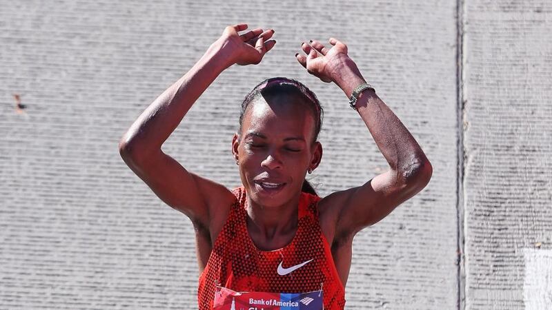 Rita Jeptoo of Kenya celebrates after winning of the 2014 Bank of America Chicago Marathon on October 12, 2014 in Chicago, Illinois. Jeptoo had tested positive for EPO two days before the New York Marathon on November 2nd. Photograph: Getty Images