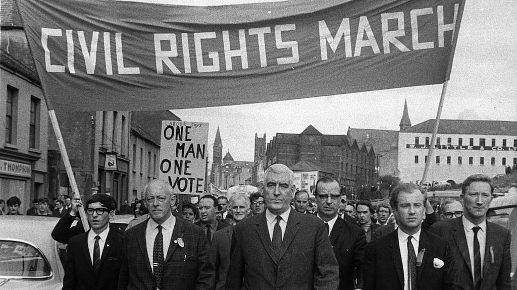 The Derry Civil Rights march moving off from Waterside railway station, heading towards Duke street. Leading the marchers are Eddie McAteer, the Nationalist leader, Gerry Fitt, Republican Labour MP, and Ivan Cooper, chairman of the Derry branch of the Labour Party.