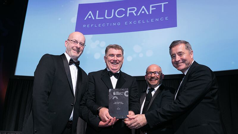 Anthony Greene, Awards Judge, presents the Sub-Contractor of the Year - Large award to Alucraft team