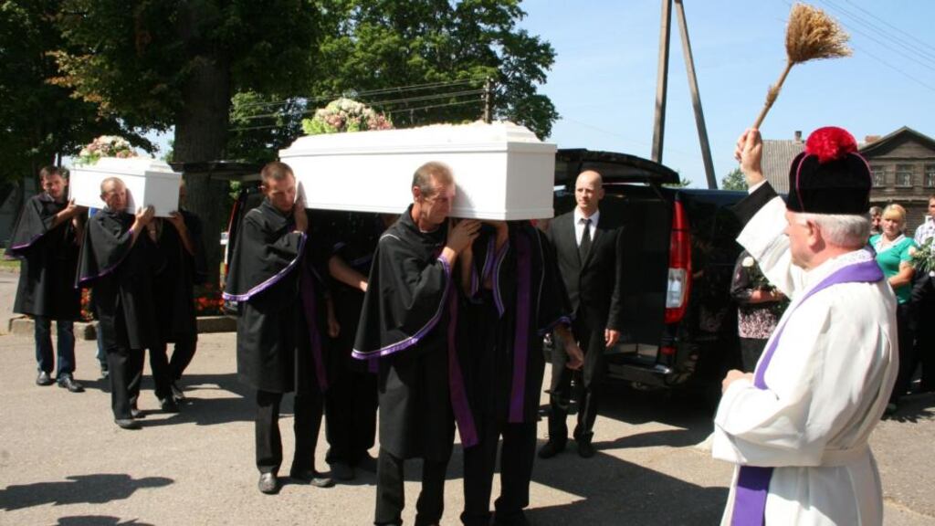 The funeral cortege of Jolanta Lubiene and her daughter Enrika at the village of Gadunavas in Lithuania.