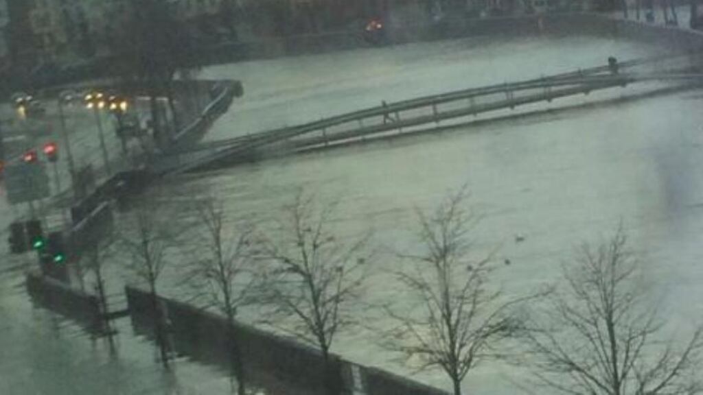 The River Lee has burst its banks in Cork city centre. Photograph: Damian Ó Laocha
