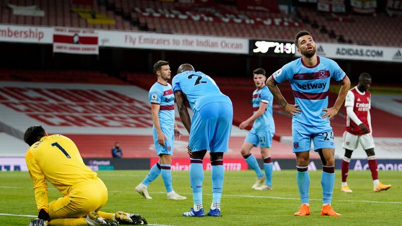 West Ham players look dejected adrer Arsenal’s winner. Photograph: Will Oliver/EPA