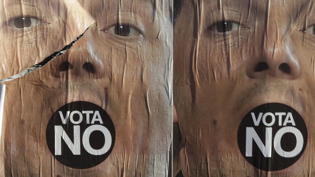 Anti-referendum posters displaying outgoing premier Matteo Renzi: Italy’s economy has fallen into political and economic uncertainty. Photograph: Gregorio Borgia/AP