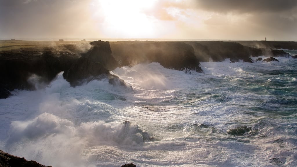 In evocative verse, the poet describes the sun setting off the west coast of Ireland as waves break and crash against cliffs