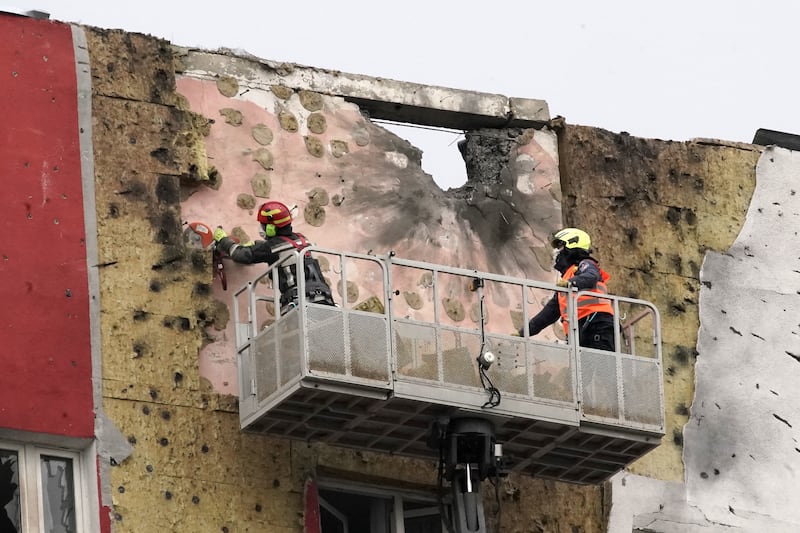 Specialists work on the facade of a damaged apartment building following a drone attack in Moscow. Photograph: Tatyana Makeyeva/AFP via Getty Images