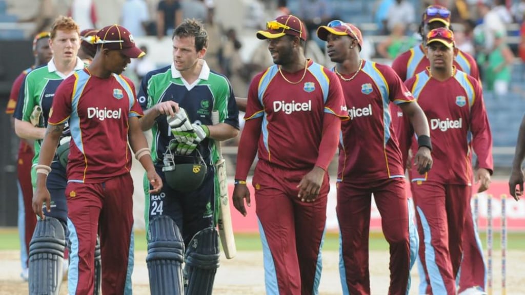 Ed Joyce and Kevin O’Brien leave the pitch with the West Indies players after Wednesday’s victory. Photograph: West Indies Cricket Board.