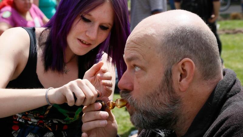 A participant at the 4/20 celebration smokes a pipe in Civic Center Park in Denver yesterday. Photograph: Rick Wilking/Reuters