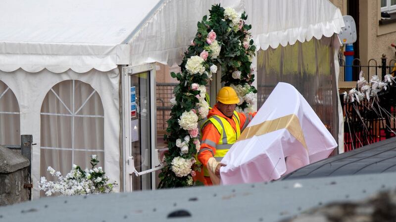 A table is removed as gardaí and contractors remove the wedding marquee at Burton Park, Leopardstown this afternoon which has been ordered to be taken down by a court. Photograph: Colin Keegan, Collins Dublin