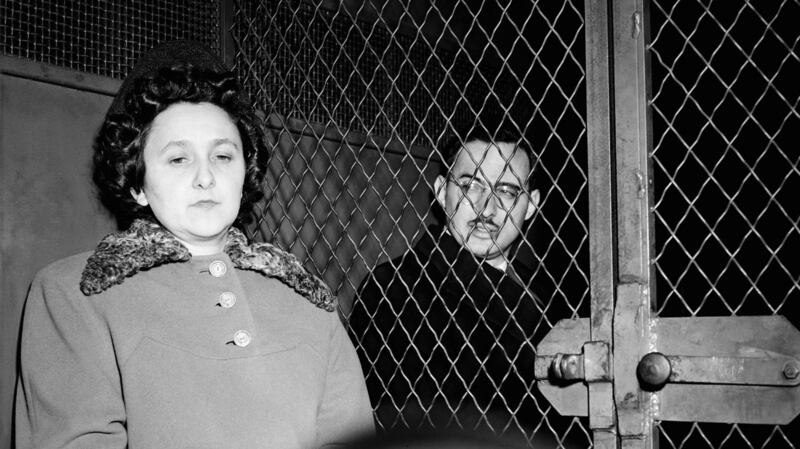 Ethel and Julius Rosenberg sitting in police van after being convicted of espionage.