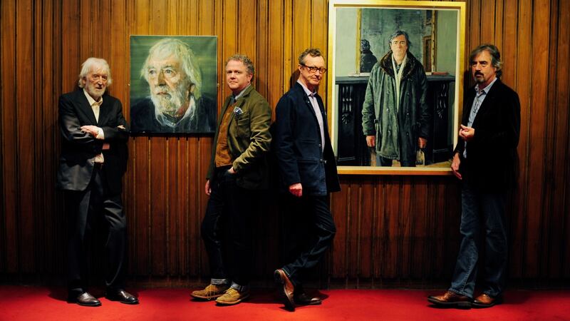 Tom MacIntyre (left) with artist Colin Davidson and Playwright Sebastian Barry (right) with artist Mick O’Dea at the Abbey Theatre in Dublin in 2013. Photograph: Aidan Crawley