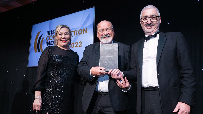 Gerry Wyne, Awards Judge, presents the Sub-Contractor of the Year – Large award to Leonard Cooper and Michelle Cooper, Cobec Engineering.