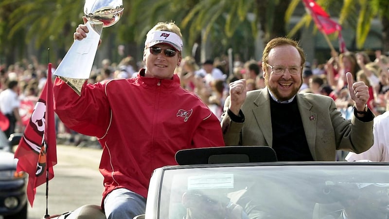Buccaneers’ head coach Jon Gruden with the late Malcolm Glazer leading the trophy parade after the Buccaneers won the Super Bowl in 2003. Photo: Peter Muhly/AFP via Getty Images