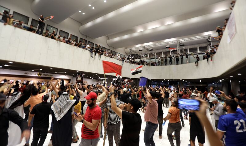 Supporters of Muqtada al-Sadr inside the Iraqi parliament building on Wednesday. Photograph: Ahmed Jalil