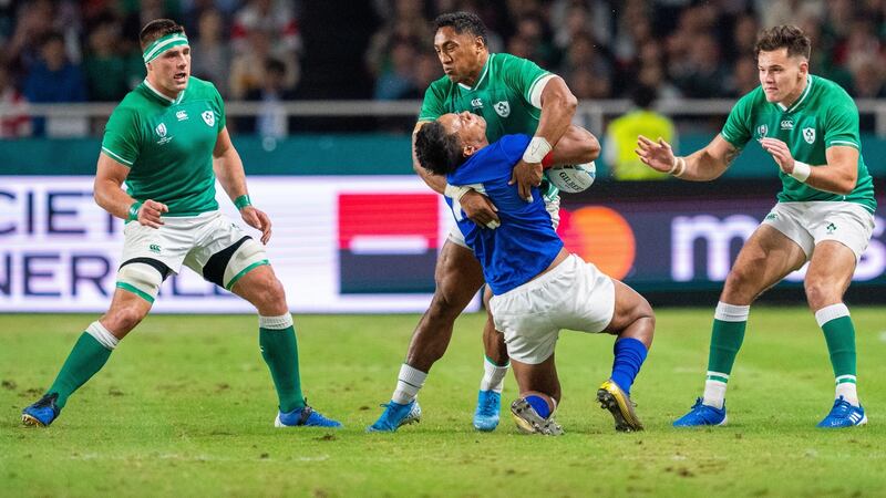 Bundee Aki tackles Samoa’s Ulupano Seuteni, a challenge that saw the Ireland centre receive a red card. Photograph: Hiroshi Yamamura/EPA
