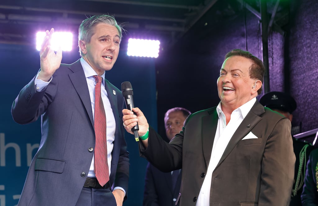 Taoiseach Simon Harris, pictured with broadcaster Marty Morrissey, is well suited to an era that can’t bear silence or stillness Photograph: Colin Keegan, Collins Dublin