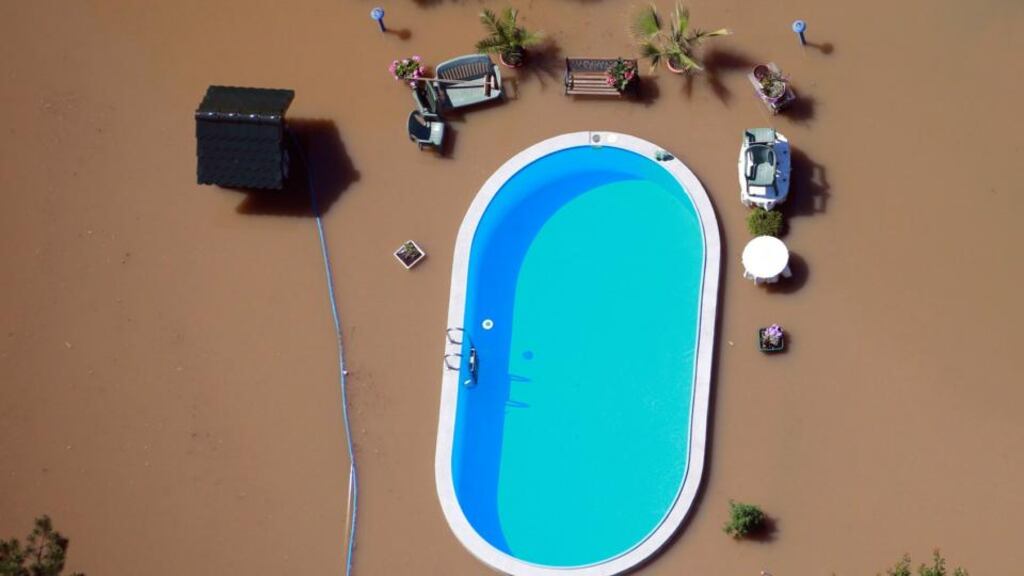 A garden with a swimming pool is inundated by the waters of the Elbe river during floods near Magdeburg in Saxony-Anhalt. Photograph: Thomas Peter/Reuters