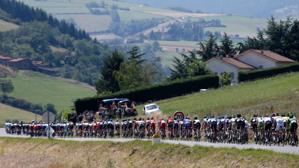 The peleton early in the 13th stage of the Tour de France cycling race, over from Saint-Etienne to Chamrousse. Photograph: EPA