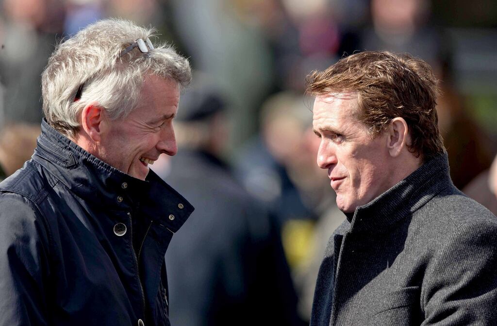Ryanair’s Michael O’Leary and AP McCoy talk horseracing at the Punchestown festival. Photograph: Morgan Treacy/Inpho