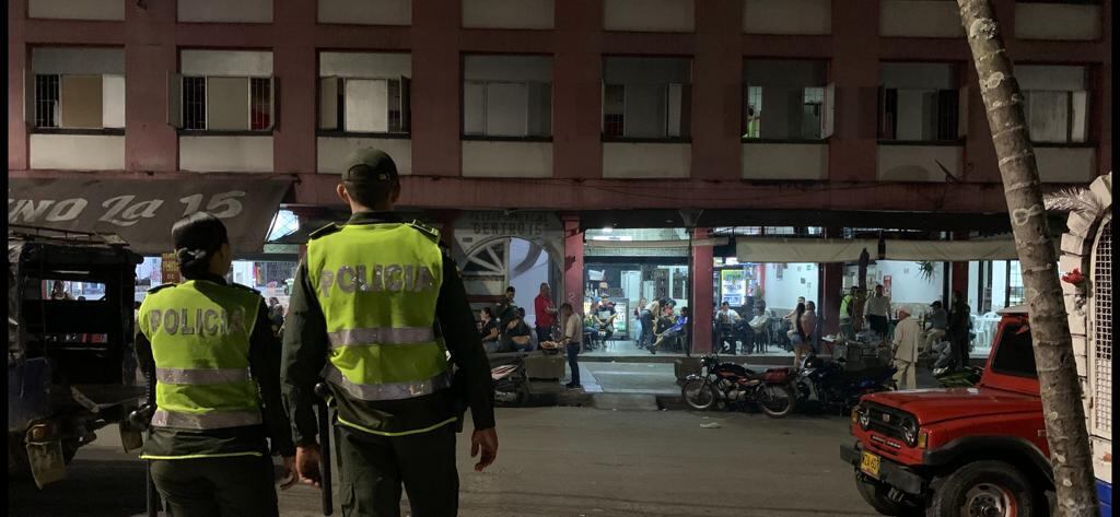 Police keep a watchful eye in the square. Photograph: Peter Murtagh