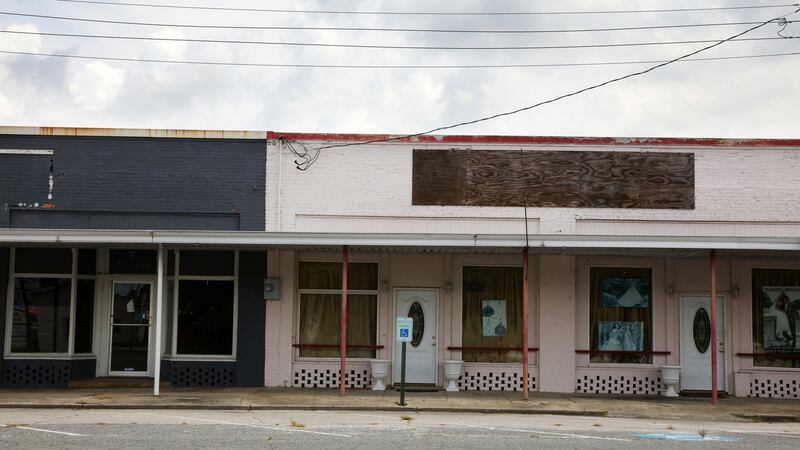 Boarded-up shops in Garland, North Carolina. Photograph: Travis Dove/ICIJ