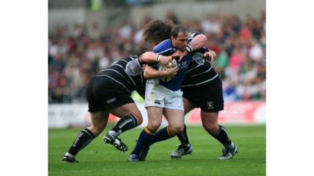 The Leinster outhalf Felipe Contepomi is tackled by Paul James
and Adam Jones of Ospreys during last evening's Celtic League match
at the Liberty Stadium, Swansea.