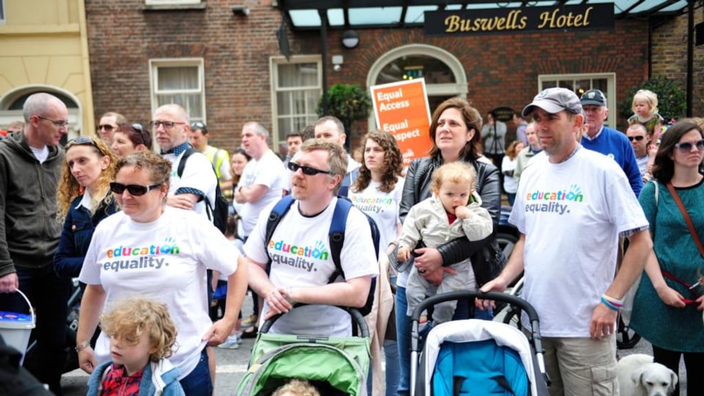 Parents and their children at a demonstration outside Leinster House organised by Education Equality calling for religious equality in education. Photograph: Aidan Crawley/The Irish Times