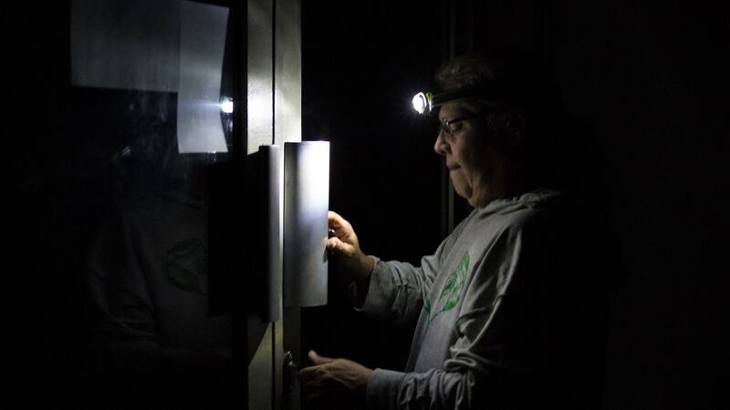 A man enters a Caracas residential building in darkness. Sunday is the third day Venezuelans remain without communications, electricity or water, in an unprecedented power outage. Photograph: Cristian Hernandez/AFP/Getty Images