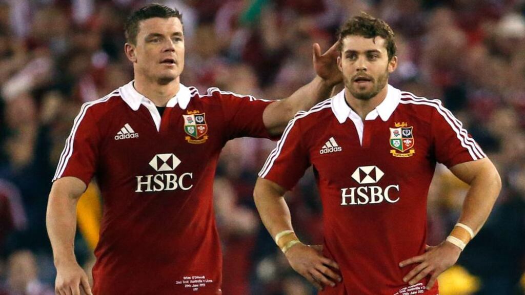 Brian O’Driscoll (L) touches teammate Leigh Halfpenny, after he failed to kick a penalty at the end of the second test match in Melbourne. Photograph: David Gray/Reuters