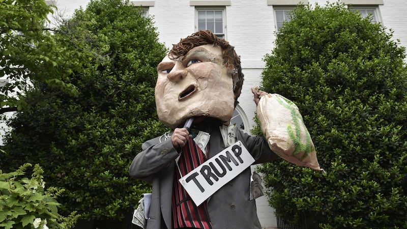 A demonstrator protests outside of the Republican National Committee where Donald Trump met party leaders on Capitol Hill in Washington, DC. Photograph: AFP/Getty Images