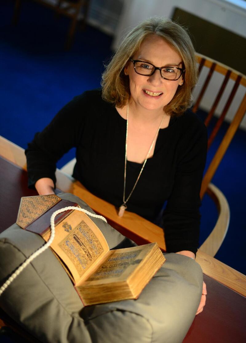 Chester Beatty Library: Fionnuala Croke with the Koran copied and illuminated by Ibn al-Bawwab, in Baghdad, between 1000 and 1001. Photograph: Bryan O’Brien