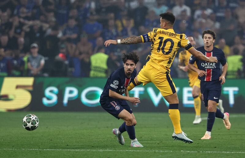Paris Saint-Germain's midfielder Vitinha in action against and Inter Milan's Lautaro Martinez during the Champions League final in Munich. Photograph: Franck Fife/AFP via Getty Images