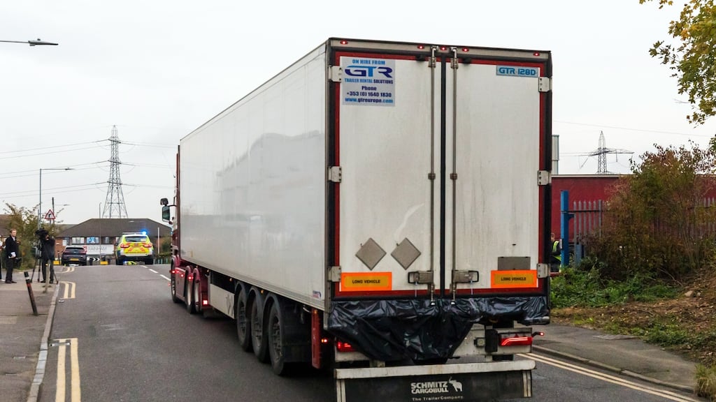 Police drive the lorry container along the road from the scene in Waterglade Industrial Park in Grays, Essex, Britain. Photograph: Vickie Flores/EPA