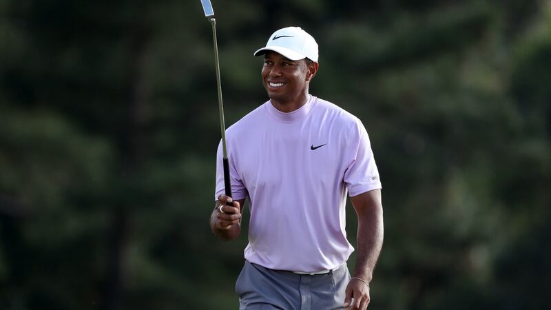 Tiger Woods acknowledges the crowd as he walks on to the green on the 18th hole during the third round of the Masters at  Augusta National Golf Club. Photograph: Jonathan Ernst/Reuters