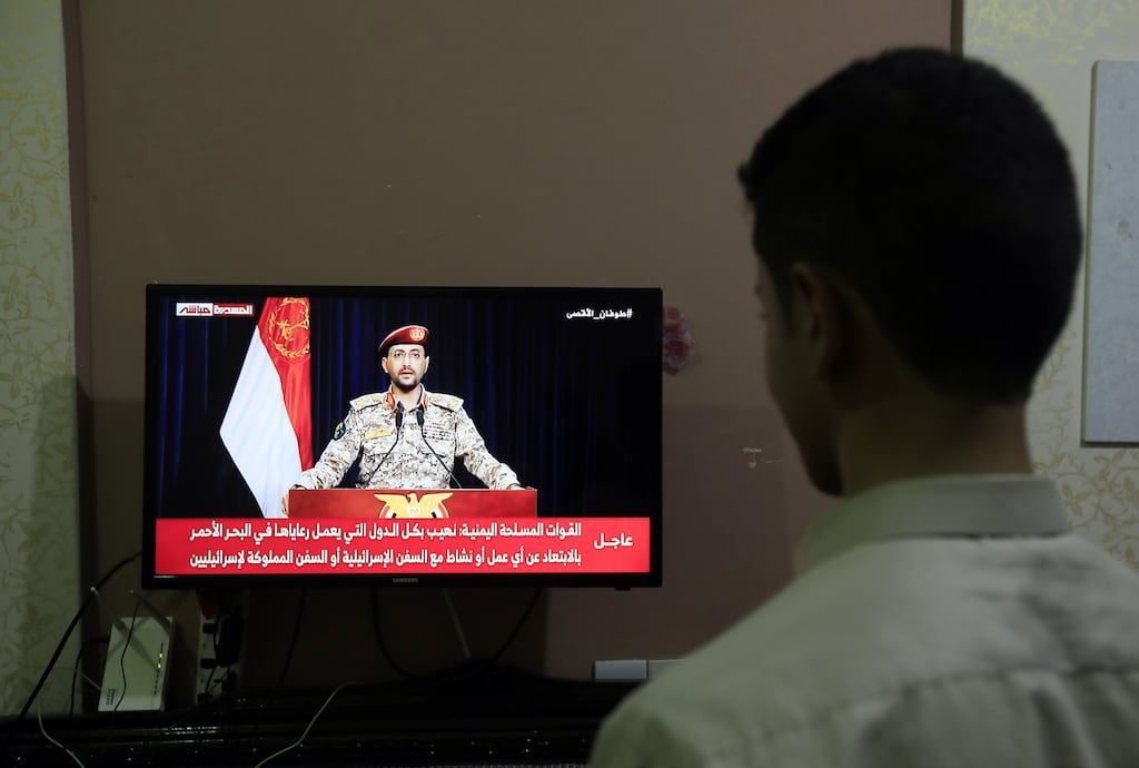 Houthi spokesman Yahya Saree speaks on TV after Houthi rebels seized an Israeli cargo ship in the Red Sea at Sana'a, Yemen on Sunday