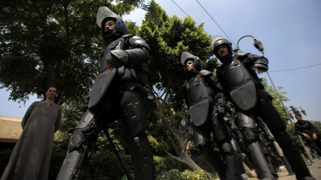 Riot police walk to take position at a protest in Cairo. A Transparency International survey in Egypt found that 78 per cent of respondents believed the police were corrupt or extremely corrupt. Photograph: Amr Abdallah Dalsh/Reuters.