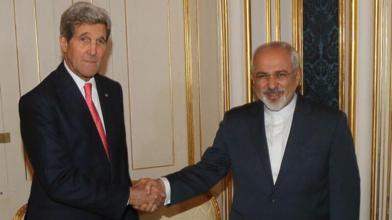 US secretary of state John Kerry (left) and Iranian foreign minister Mohammad Javad Zarif shake hands during the talks between the E3+3 (France, Germany, UK, China, Russia, US) and Iran in Vienna. Photograph: Ronald Zak/EPA