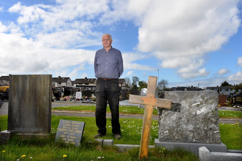Brian Scanlon at the unmarked grave of Peter Bergmann. Photograph: Alan Betson