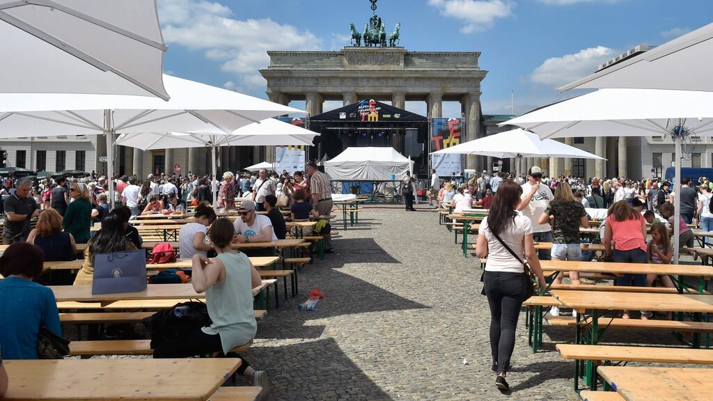 A glorious day at Priser Platz, in before the Brandenburg Gate in Berlin during the German-French street festival. “But if you are having fun, you can be sure the local public order officer is never far away.” Photograph: Getty Images