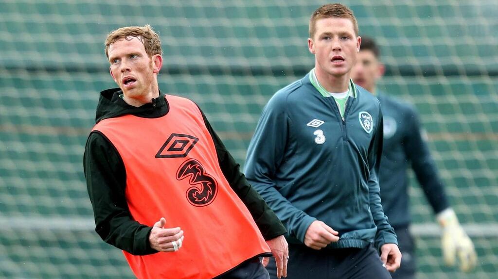Paul Green and James McCarthy in action during training in Malahide yesterday. The Leeds man lined out for the “probables” in training before the departure for Stockholm. Photograph: James Crombie/Inpho