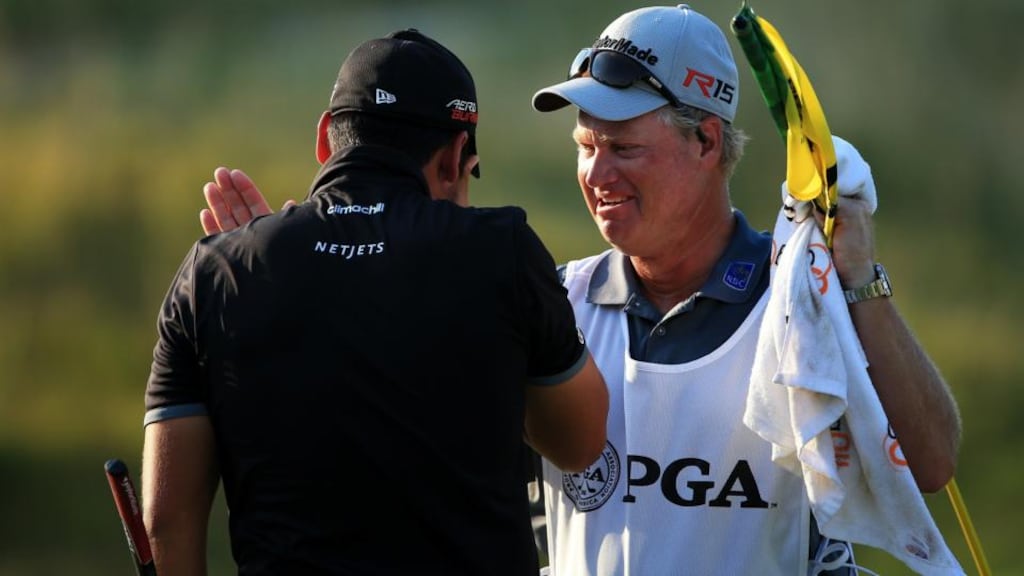 An emotional Jason Day celebrates his PGA Championship win with his mentor and caddie Colin Swatton who has coached the Major winner since the latter was 12. Photo: David Cannon/Getty