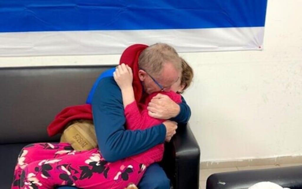 Irish-Israeli national Emily Hand and her father Thomas are reunited after her release by Hamas to the Red Cross. Photograph: Israel Defence Forces